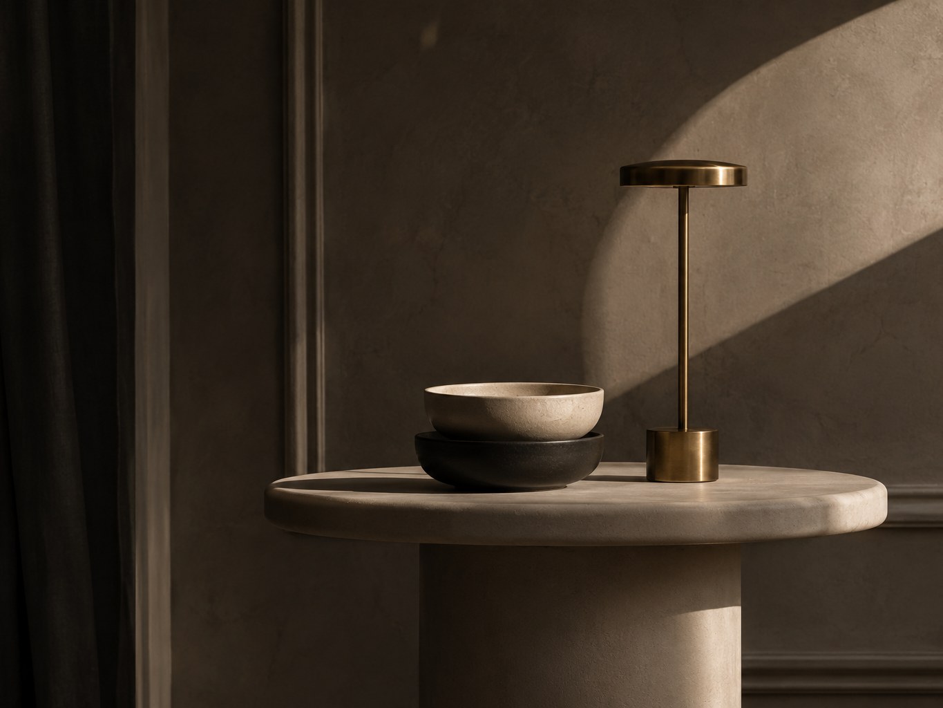 A brass lamp over a minimal still life