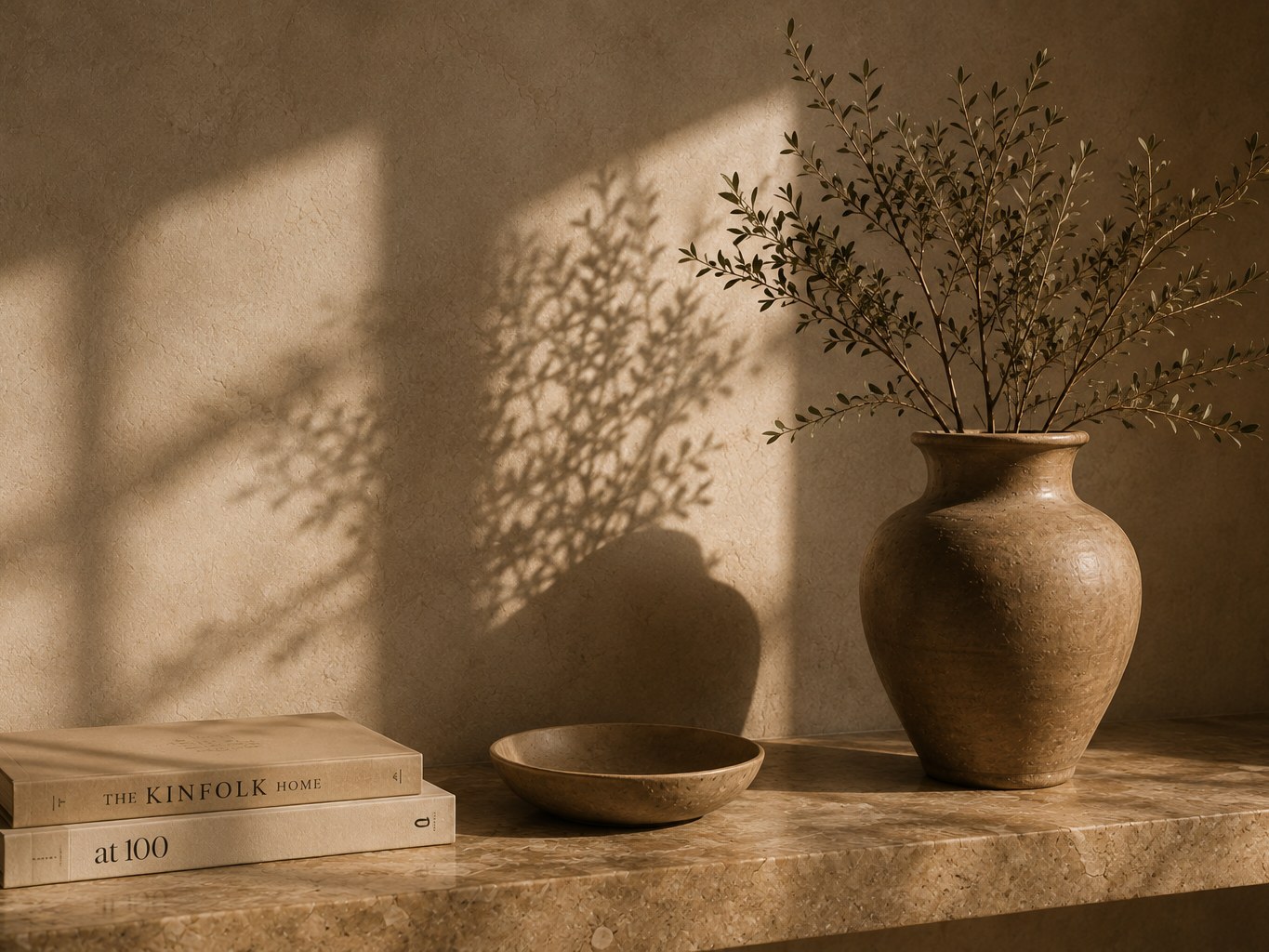 Earthenware vessels and olive branches in sunlight
